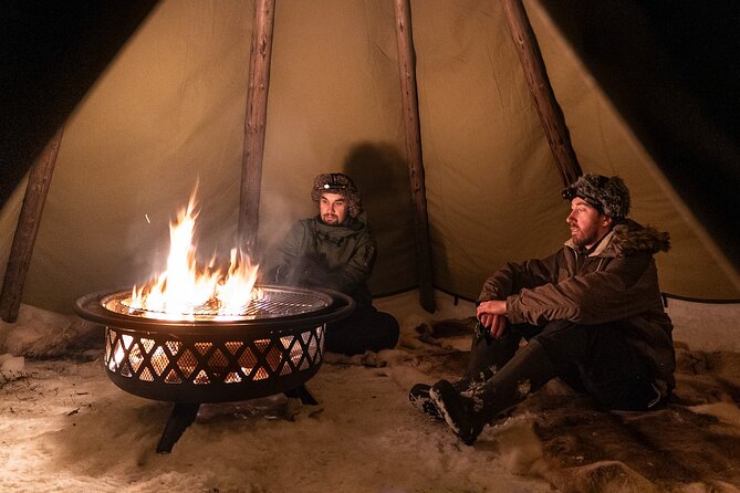 Evening Ski Trek to the Wilderness - Extra Small group - The kota basecamp: fire, grilled snacks, and reindeer-skin comfort