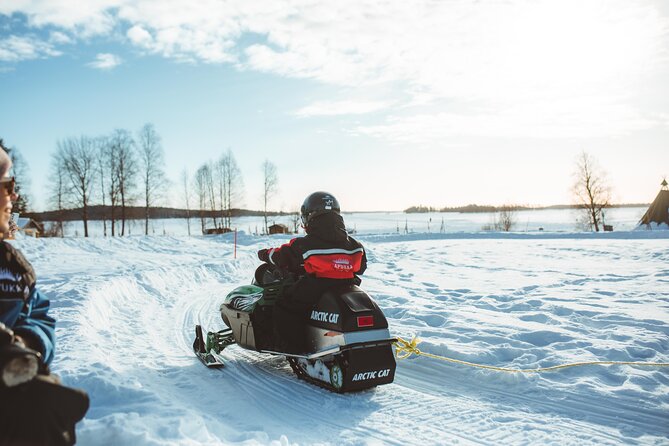 Family Snowmobiling in Rovaniemi, Apukka Resort - Kid-first design: sleigh seating and then mini-snowmobiles in the safe yard