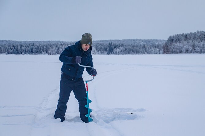 First Ice Fishing Experience in Rovaniemi - Warming up the Finnish way: snacks, hot drinks, and an open-fire break