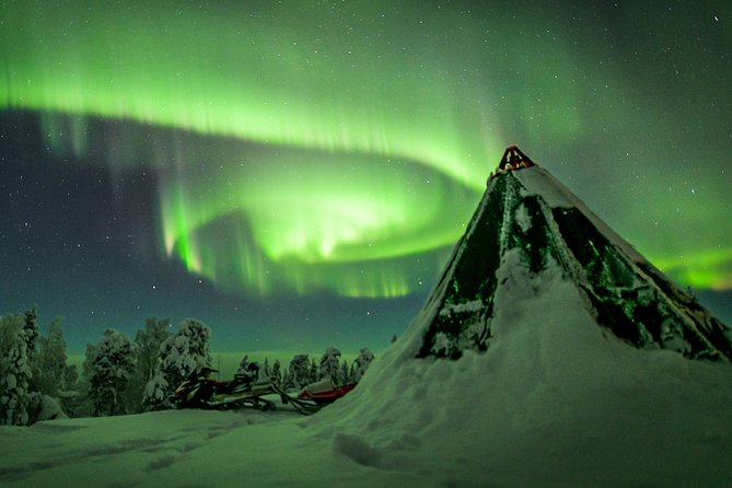 Northern Lights Snowmobile Sleigh Ride - The tepee campfire break turns waiting into the highlight
