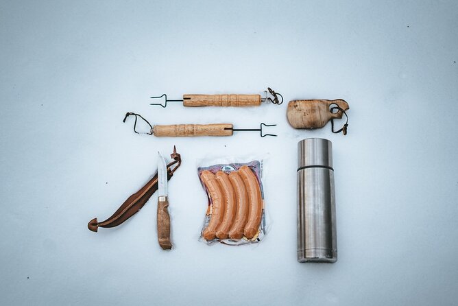 Rovaniemi: Snowshoeing in a magical snowy forest - Fire-side Finnish comfort: sausages, hot juice, and local stories