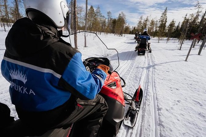 Snowmobiling and ice fishing in Apukka Resort, Rovaniemi - Ice Fishing on a Frozen Pond: Pike, Perch, and Trout